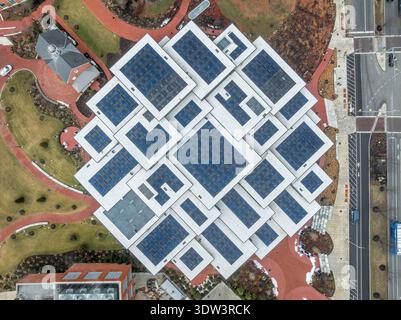 Aerial view of futuristic solar panels on the Johns Hopkins University Bloomberg student center roof, forming interesting geometric shapes Stock Photo