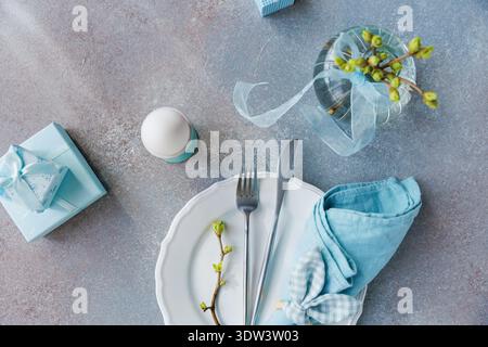 Easter Morning Table Setting with Gifts and Egg Stock Photo