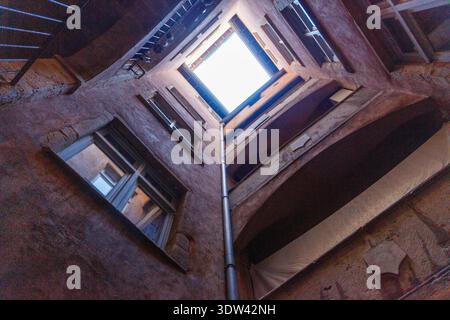 Looking up through an urban courtyard to the sky. Stock Photo