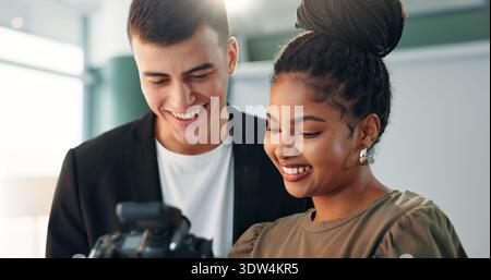 Woman, photographer and camera with model in studio for photoshoot results, catalog and selection. Smile, people and backstage with image, review Stock Photo