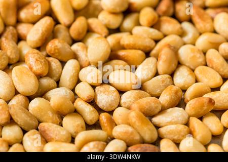 Organic Cooked Roasted Pine Nuts in a Pan Stock Photo