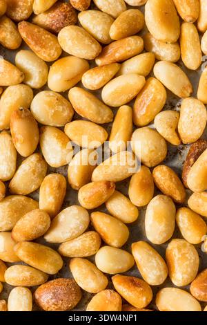 Organic Cooked Roasted Pine Nuts in a Pan Stock Photo