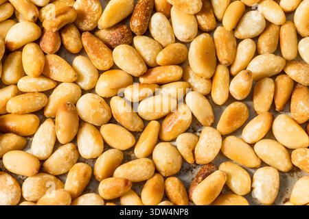 Organic Cooked Roasted Pine Nuts in a Pan Stock Photo