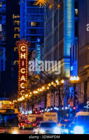 Night view of the illuminated Chicago Theatre marquee and city street lights in downtown Chicago, Illinois Stock Photo
