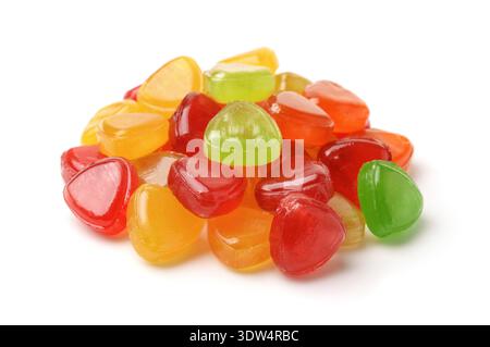 Pile of colorful hard fruit candies isolated on white Stock Photo
