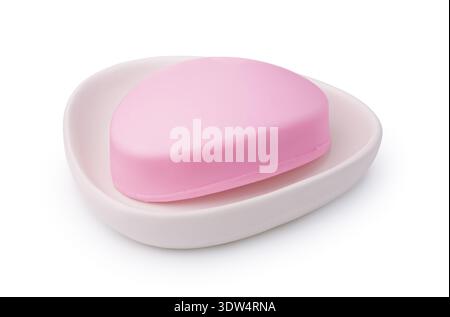 Pink soap bar in ceramic soap dish isolated on white Stock Photo