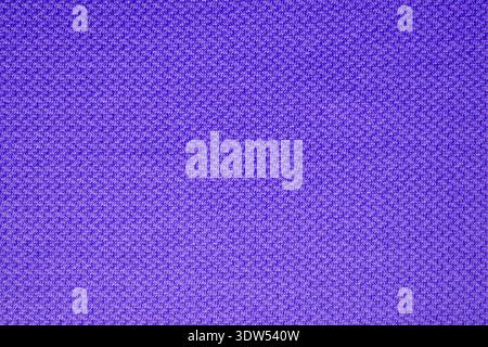 Full frame close up background texture of purple knitted fabric with fine pattern detail. Stock Photo