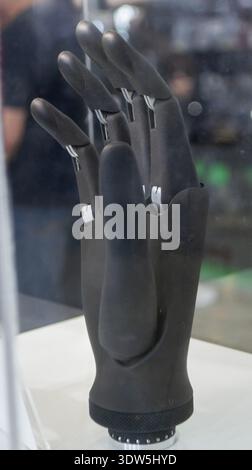 Bionic arm prosthesis. Plastic prosthesis printed on a 3D printer. Robotic arm. Robotics prosthesis for hand printed on a 3D printer from plastic powder. Modern new innovation medicine technologies. Stock Photo