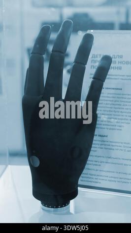 Bionic arm prosthesis. Plastic prosthesis printed on a 3D printer. Robotic arm. Robotics prosthesis for hand printed on a 3D printer from plastic powder. Modern new innovation medicine technologies. Stock Photo