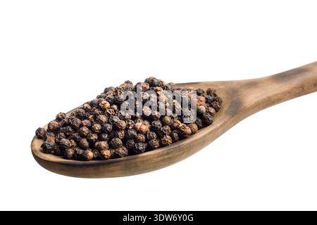 Black pepper corn on wooden spoon, isolated on white background. Stock Photo