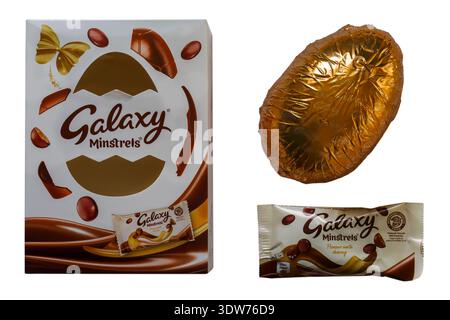 Galaxy Minstrels Easter egg removed from box with bag packet of Galaxy Minstrels isolated on white background Stock Photo