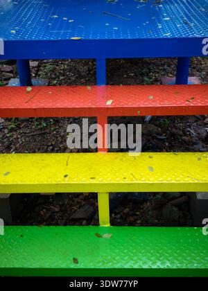 Colourful steps made of metal plate in the children's playground area Stock Photo