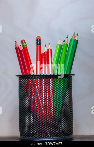 red and green pencils illustrating complementary contrast and chromatic opposition in color theory. Stock Photo