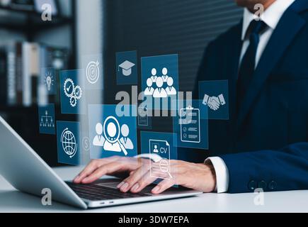 Recruitment and HR management concept, business professional using laptop to analyze candidates, review CV profiles and streamline talent acquisition, Stock Photo