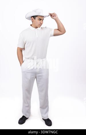 Man in white uniform and chef hat posing in studio Stock Photo