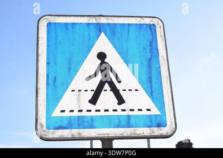 weathered old pedestrian crossing sign in France Stock Photo