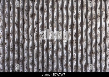 Deteriorating Concrete Wall with Cracks and Distressed Grunge Texture Background Stock Photo