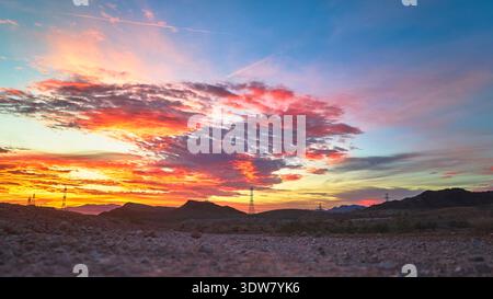 Sunrise Nevada Desert with Lava Butte Dramatic Clouds and Power Lines Ground Level Stock Photo