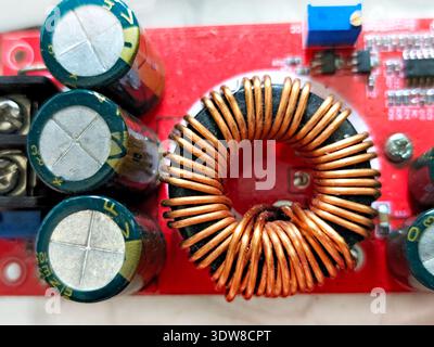 Copper coil, inductor winding part on a pc motherboard, circuit board ...