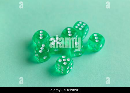 Green game dices on turquoise background Stock Photo
