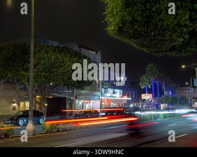 Street scene at night with passing car lights along Lombard Street  in Marina district  of San Francisco California Stock Photo