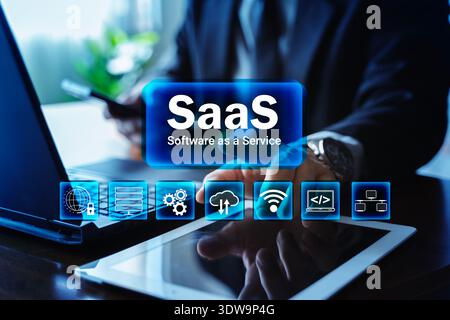 SaaS software as a service concept with businessman using laptop, smartphone and tablet. Cloud computing, subscription platform, data security, networ Stock Photo