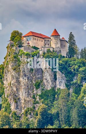 Distant view of Bled Castle which is a medieval castle built on a precipice above the city of Bled overlooking Lake Bled, Lake Bled ,Slovenia, Europe Stock Photo