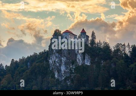 Distant view of Bled Castle which is a medieval castle built on a precipice above the city of Bled overlooking Lake Bled, Lake Bled ,Slovenia, Europe Stock Photo