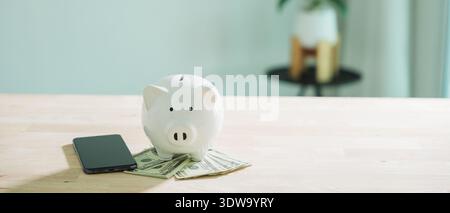 Global economy affects money bank piggy finance stock growth business, economic concept to save and invest shown with white piggy bank on US dollar bi Stock Photo