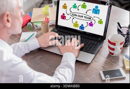 Join our team concept shown on a laptop screen Stock Photo