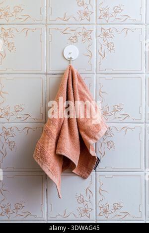 A towel hung on the tiles on the wall of the kitchens of poor people who lived in the Soviet era. Stock Photo