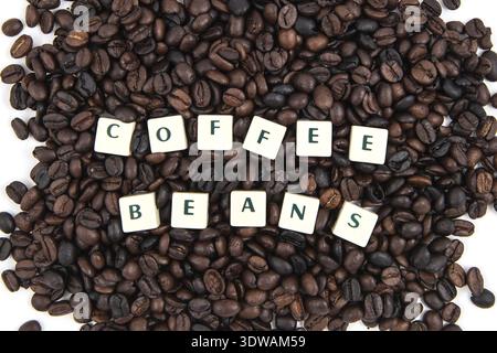 COFFEE BEANS white cube text on white background AND coffee beans background Stock Photo