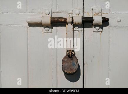 Padlock on a closed gate in Malta Stock Photo