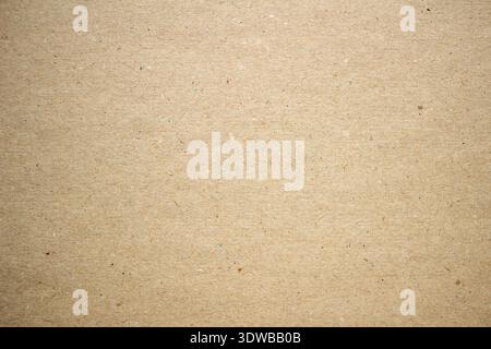 A close-up of a textured gray craft paper background, showcasing a rustic and natural surface. The subtle gray tones and uneven texture make it ideal Stock Photo