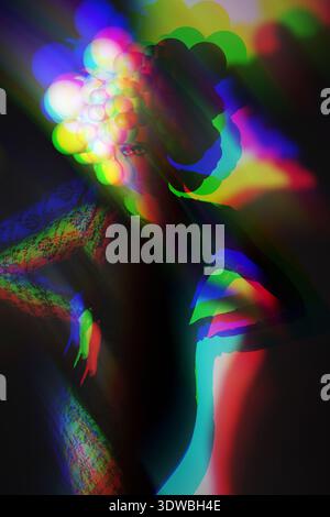 Woman's body creating an abstract silhouette with colorful modern glitch art Stock Photo