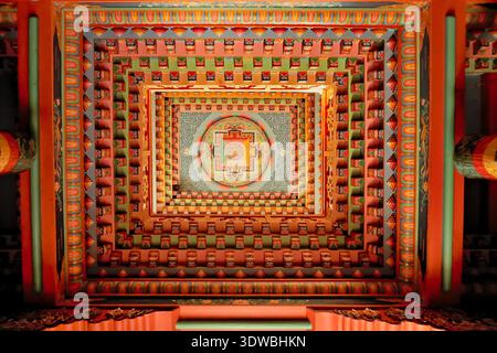 The colorful ceiling inside the tibetan buddhist temple of Upper Pisang, painted with patterns, details, elements in many bright colors, Annapurna Circuit Trek, Nepal 2022 Stock Photo