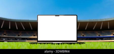 Blank screen laptop over grass field at a soccer and football stadium. Empty display device for mockup in 8k - high resolution 3D rendering. Horizonta Stock Photo