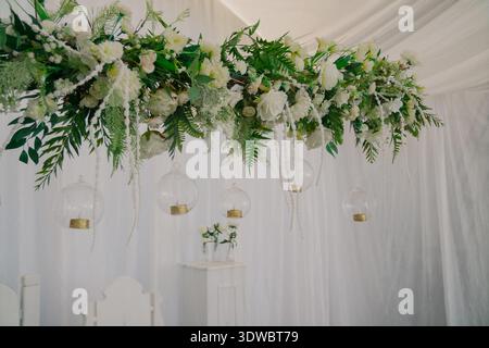 Decorating a wedding table with fresh flowers Stock Photo