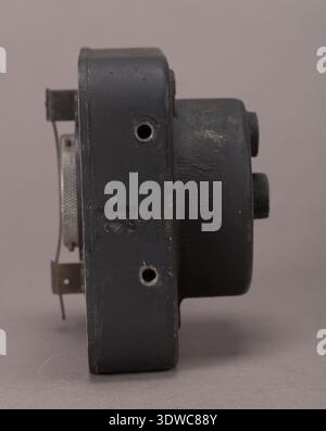 Recorder, V-G 4.5in. x 4.5in. x 3.5in.; black with unpainted knob on back face is an aircraft instrument designed to record operational or performance data from onboard systems. The archival photograph documents the square black housing, dimensional proportions, and rear control knob configuration used in aviation recording equipment. Stock Photo