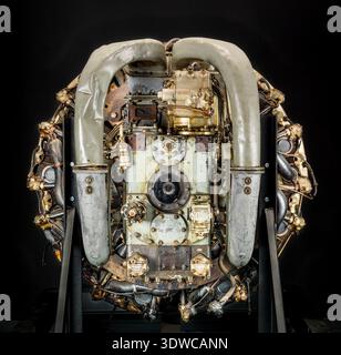 Mitsubishi Ha 42 Model 41 Ru (Ha 214 Ru) is a Japanese World War II eighteen-cylinder, two-row, air-cooled radial aircraft engine rated at 1,715 kW (2,300 hp) at 2,500 rpm, with 54.1 liters displacement and two-speed reduction gearing. The historical photograph documents the reciprocating powerplant mounted on a stand with specified bore, stroke, and supercharging features. Stock Photo