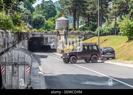 A view of the tunnel between Novice Cerovica and Stampar Makarije streets in Cetinje. Car drives past. Cetinje, Montenegro - June 20, 2021 Stock Photo