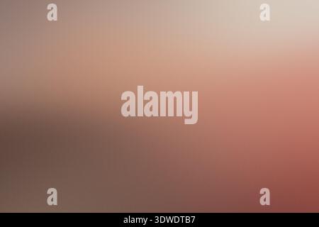 Abstract background blending warm peach, terracotta, and neutral brown colors with soft blur Stock Photo