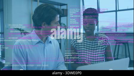 Discussing coworkers in blue shirt and checked top reviewing laptop code at desk, with code overlay Stock Photo