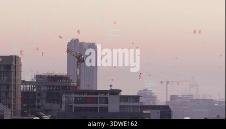 Rising high-rise under construction over harbor skyline, with tower crane and AR overlays Stock Photo