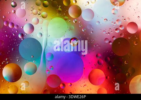 Dive into a mesmerizing abstract scene of colorful bubbles. The mix of vibrant hues creates a dreamy background, evoking a sense of artistic wonder an Stock Photo