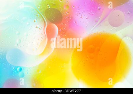 An abstract artwork showcasing vibrant hues of orange, yellow, pink, and blue, creating a fluid, dynamic composition. Captivates with its depth, color Stock Photo