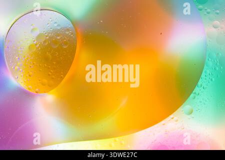 Dive into a mesmerizing journey of vivid color with this abstract image featuring intertwined bubbles in shades of orange, yellow, and purple, creatin Stock Photo