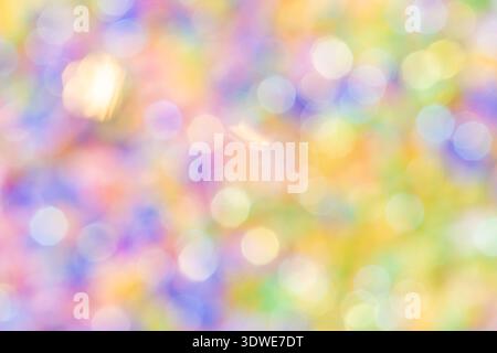 Abstract background featuring a blend of pastel colors forming a gentle, defocused bokeh effect. The soft and blurred circles create a dreamy and sere Stock Photo