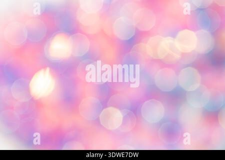 A dreamy, defocused abstract bokeh background with soft pink and purple hues. The circular light patterns create a serene and ethereal ambiance, perfe Stock Photo