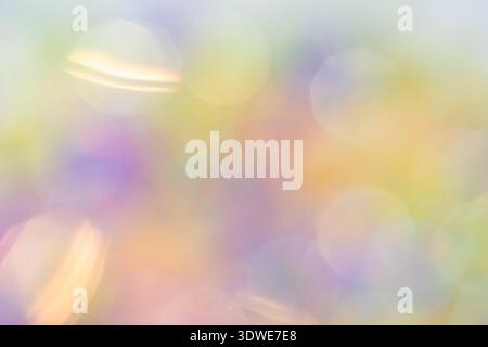 This image features a tranquil abstract bokeh background with soft pastel colors. The defocused lights create a serene and soothing atmosphere, ideal Stock Photo